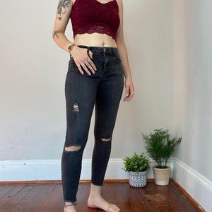 faded black skinny jeans, ripped knees, frayed bottom, size 26